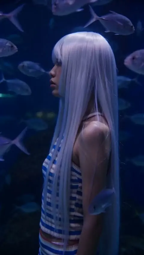 Woman in a blue underwater world